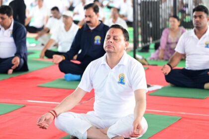 Pushkar Singh Dhami performs yoga on International Yoga Day