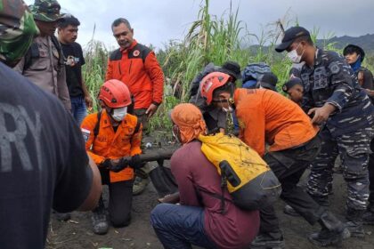 Indonesian rescuers find 1 body after volcano eruption as search continues for 2 more